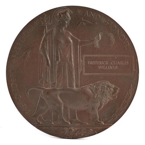 670 - A World War I bronze death plaque awarded to Frederick Charles Williams within it's cardboard case.