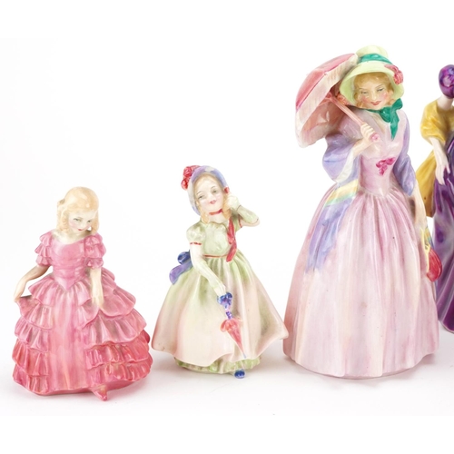 398 - A group of nine Royal Doulton fine bone china figurines including Blithe Morning and Miss Demure.