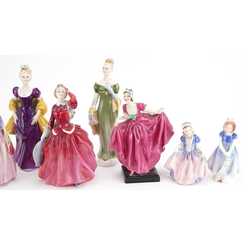 398 - A group of nine Royal Doulton fine bone china figurines including Blithe Morning and Miss Demure.