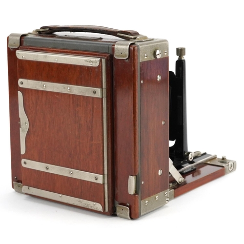 476 - An early 20th century Ika, Dresden quarter-plate mahogany case field camera, 16cm wide.