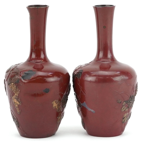 56 - A pair of Japanese bronzed vases relief decorated with rats amongst fruiting vines, 9.5cm high.