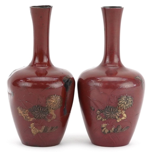 56 - A pair of Japanese bronzed vases relief decorated with rats amongst fruiting vines, 9.5cm high.