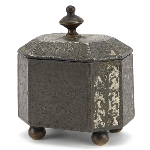 131 - A Georgian cast iron tobacco box with tamper, engraved with a phoenix and sailing ship, possibly rel... 