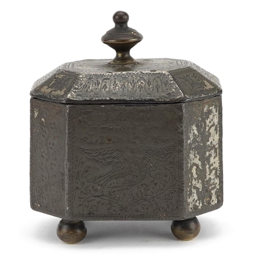 131 - A Georgian cast iron tobacco box with tamper, engraved with a phoenix and sailing ship, possibly rel... 