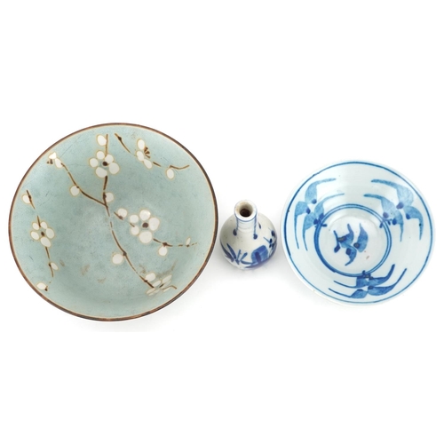 1202 - A group of Chinese porcelain including a footed bowl hand painted with cherry blossom onto a mottled... 