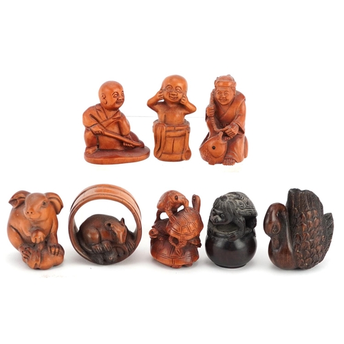 107 - Eight Chinese carved wood netsukes including a swan, tortoises, rat and children, the largest 4.5cm ... 