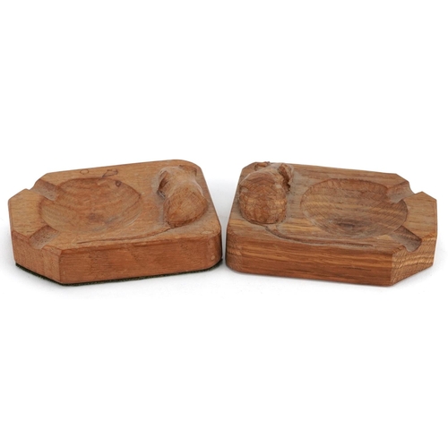 36 - Robert 'Mouseman' Thompson, two oak ashtrays, each carved with a signature mouse, 10cm in length.