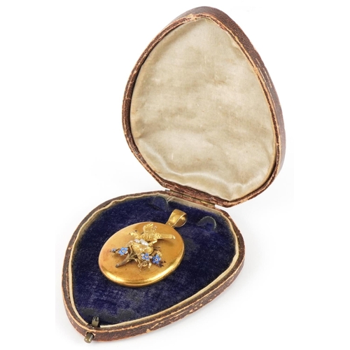 2067 - Victorian unmarked gold locket by Harry Emanuel, tests as 15ct gold, relief decorated with a bird in... 