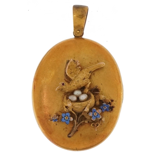 2067 - Victorian unmarked gold locket by Harry Emanuel, tests as 15ct gold, relief decorated with a bird in... 