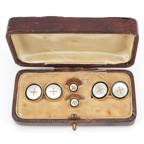 14 - Pair of 9ct gold mother of pearl and enamel cufflinks and studs, housed in a Victorian tooled leathe... 