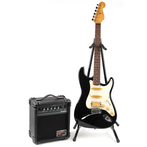 453 - An Encore Stratocaster six string electric guitar together with a 'The Animal' practice' amplifier.