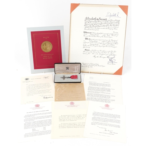 711 - An MBE medal with certificate and associated paperwork presented to Major Anthony F. Fox.