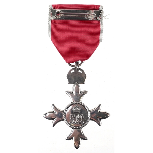 711 - An MBE medal with certificate and associated paperwork presented to Major Anthony F. Fox.