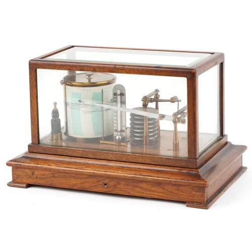 An early 20th century oak cased barograph bearing retailer's label M. W. Dunscombe Ltd. Opticians Bristol, 22cm H x 37cm W x 23cm D.