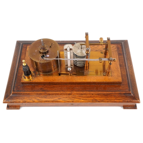 310 - An early 20th century oak cased barograph bearing retailer's label M. W. Dunscombe Ltd. Opticians Br... 