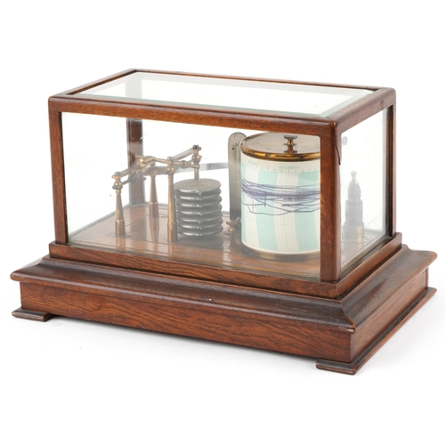 310 - An early 20th century oak cased barograph bearing retailer's label M. W. Dunscombe Ltd. Opticians Br... 