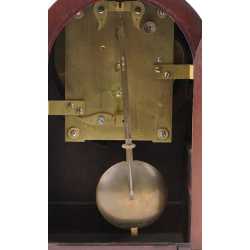 110 - An Edwardian mahogany cased mantle clock with brass inlay, the circular white enamelled dial with bl... 