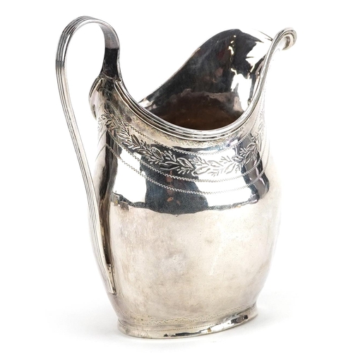 667 - A George III silver cream jug engraved with foliage, London 1799, 10.5cm high, 94.0g.