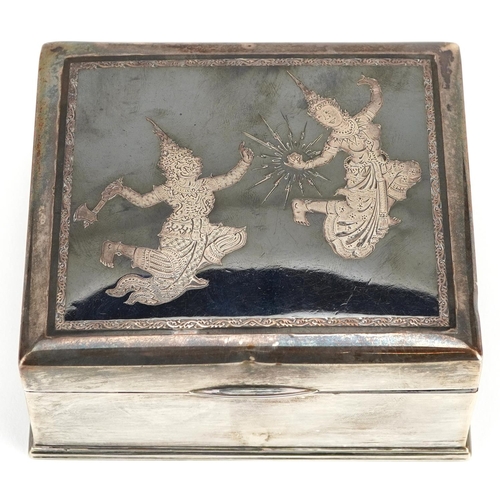 692 - A Siam sterling silver and niello work cigarette box, the hinged lid decorated with figures, 5cm H x... 