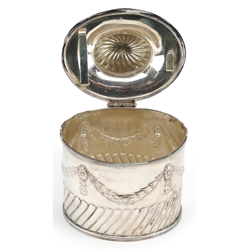 645 - Goldsmiths & Silversmiths Co Ltd., an Edwardian silver caddy with original caddy spoon to the inside... 