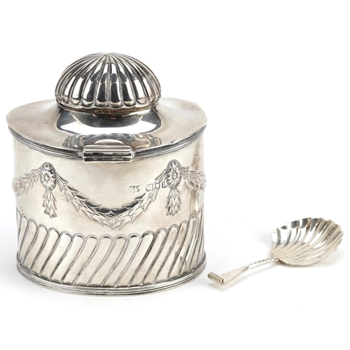 645 - Goldsmiths & Silversmiths Co Ltd., an Edwardian silver caddy with original caddy spoon to the inside... 