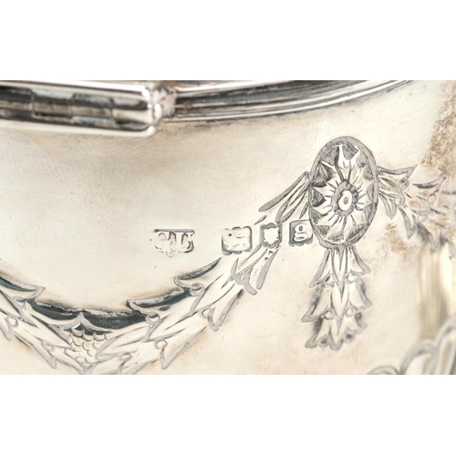 645 - Goldsmiths & Silversmiths Co Ltd., an Edwardian silver caddy with original caddy spoon to the inside... 