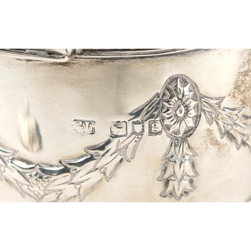 645 - Goldsmiths & Silversmiths Co Ltd., an Edwardian silver caddy with original caddy spoon to the inside... 