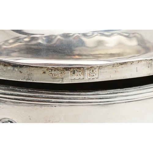 645 - Goldsmiths & Silversmiths Co Ltd., an Edwardian silver caddy with original caddy spoon to the inside... 