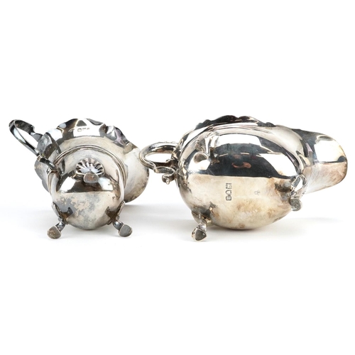 677 - Two Victorian and later silver cream jugs, each raised on three hoof feet, the larger London 1896, 1... 