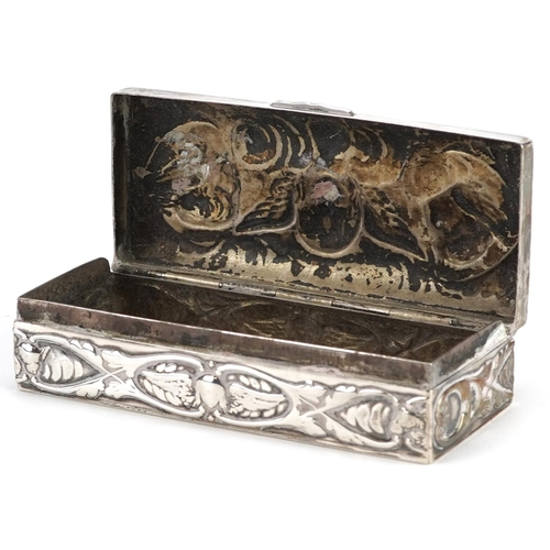 690 - William Comyns, a Victorian silver box with hinged lid, embossed with Putti and stylized flowers, Lo... 