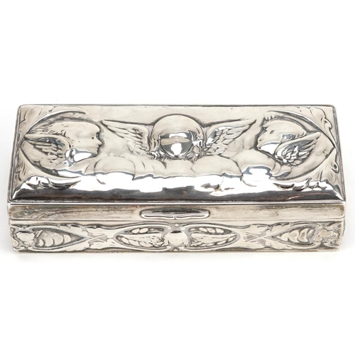 690 - William Comyns, a Victorian silver box with hinged lid, embossed with Putti and stylized flowers, Lo... 