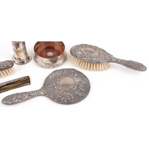 663 - Silver items including silver backed vanity dressing table items profusely embossed with foliage and... 