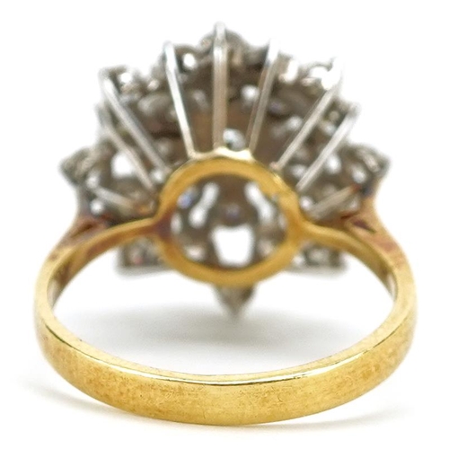 48 - An 18ct gold diamond three tier cluster ring, the ring head 18mm in diameter, size N, 5.0g.