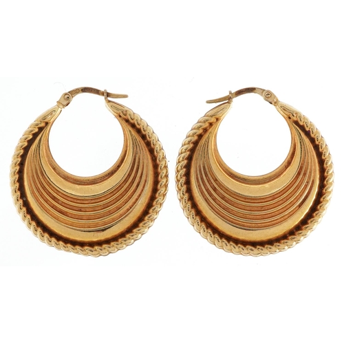 68 - A pair of 9ct gold embossed Gypsy hoop earrings, 3.2cm high, total 5.4g.