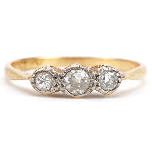 70 - An 18ct gold and platinum diamond three stone ring, size N/O, 1.8g.