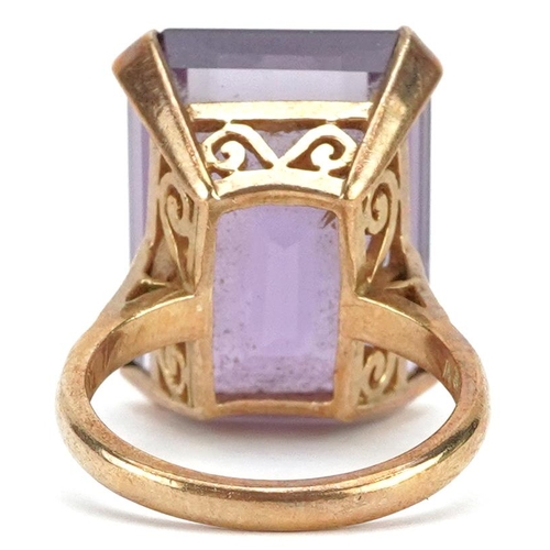 385 - A large 9ct gold rectangular cut amethyst ring, the amethyst approximately 19.80mm x 15.20mm x 11.10... 