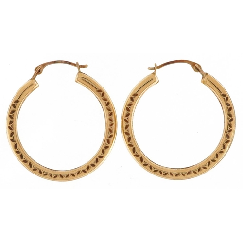 51 - A pair of 9ct gold engraved hoop earrings, 2.5cm in diameter, total 0.8g.