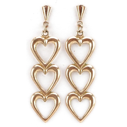 341 - A pair of 9ct gold triple love heart drop earrings, 3.3cm high, total 0.6g.