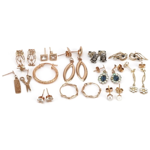 590 - A collection of earrings, some 9ct gold and silver, including hoops, owls and scissors, total weight... 