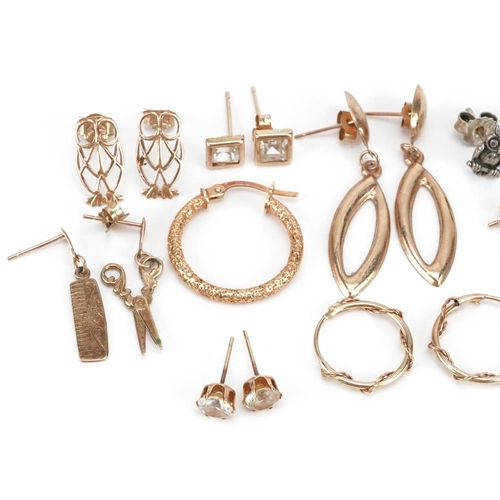 590 - A collection of earrings, some 9ct gold and silver, including hoops, owls and scissors, total weight... 