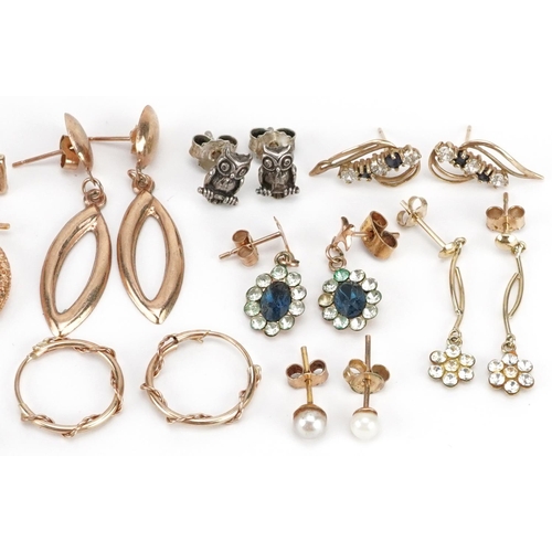 590 - A collection of earrings, some 9ct gold and silver, including hoops, owls and scissors, total weight... 