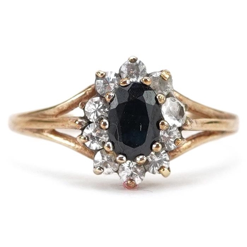 387 - A 9ct gold black spinel and cubic zirconia cluster ring, size N/O, 1.9g.