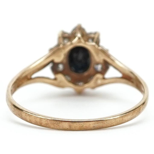 387 - A 9ct gold black spinel and cubic zirconia cluster ring, size N/O, 1.9g.