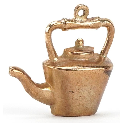 2344 - A 9ct gold charm in the form of a teapot, 2.3cm in length, 2.2g.