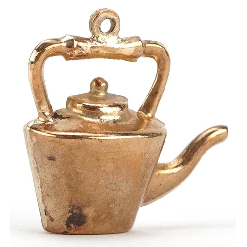 2344 - A 9ct gold charm in the form of a teapot, 2.3cm in length, 2.2g.