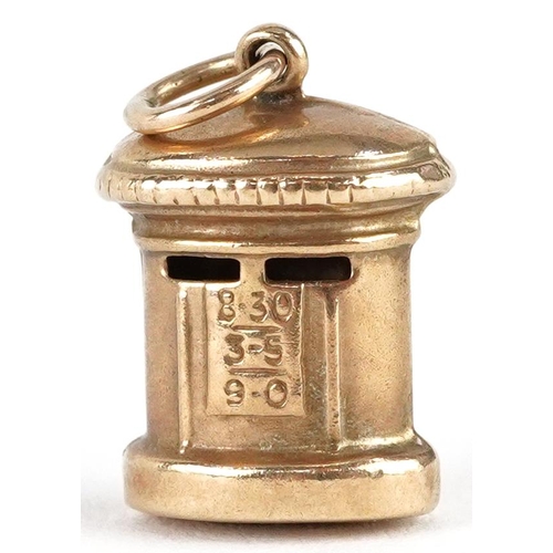 2378 - A 9ct gold charm in the form of a postbox, 1.6cm high, 1.0g.