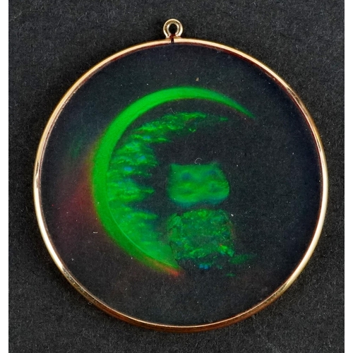 2144 - A holographic owl and moon pendant with yellow metal mount, 3.8cm in diameter.