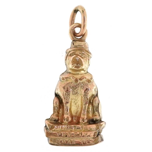 2374 - A Victorian 9ct gold charm in the form of Punch & Judy's dog Toby, 2.1cm high, 1.1g.