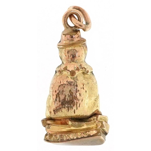 2374 - A Victorian 9ct gold charm in the form of Punch & Judy's dog Toby, 2.1cm high, 1.1g.