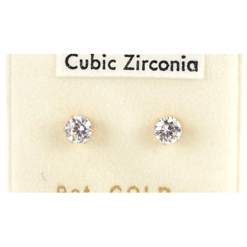 2502 - Three pairs of 9ct gold stud earrings set with diamonds and cubic zirconia, the largest 6.8mm in dia... 